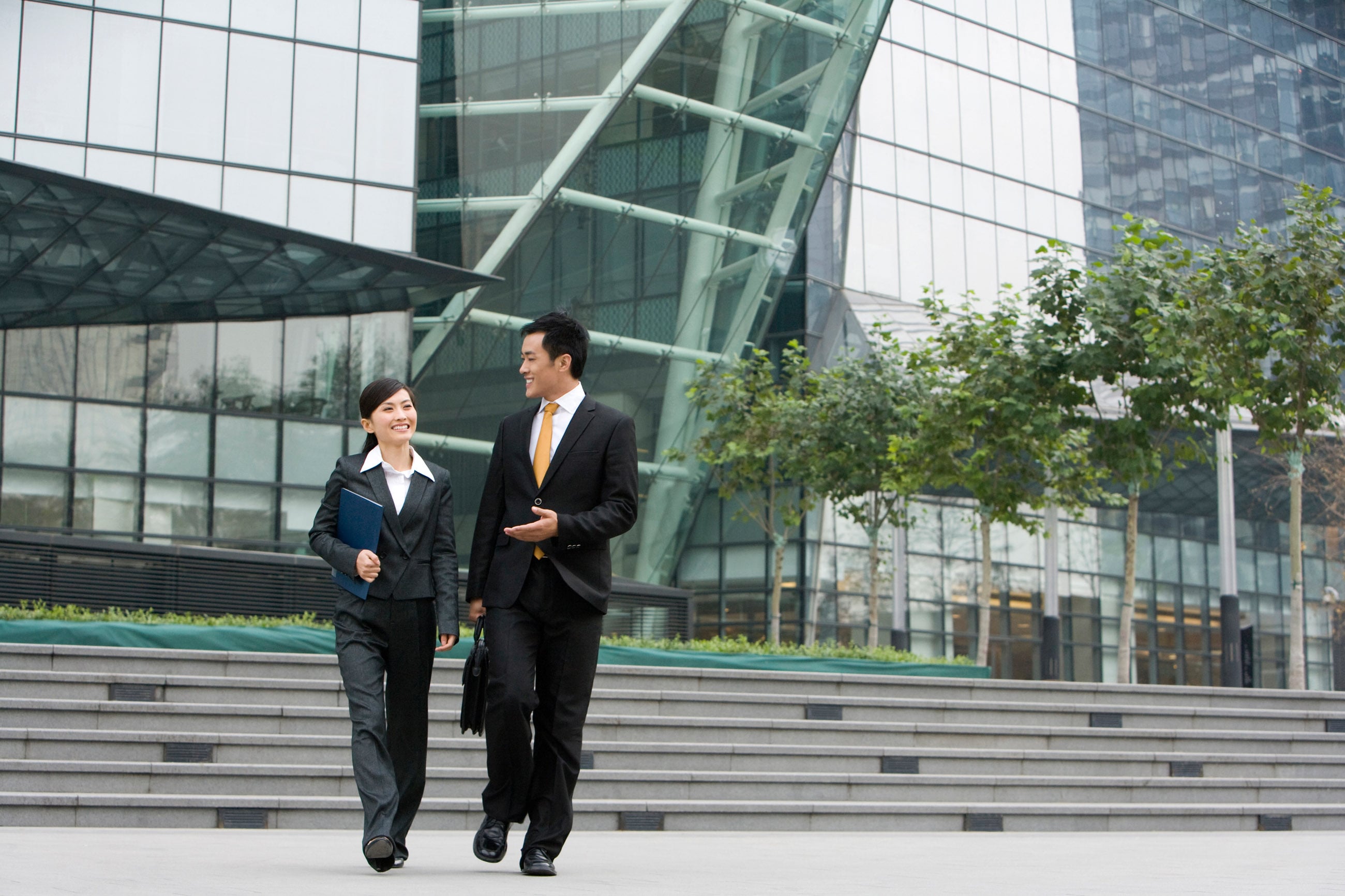 business people walking outside